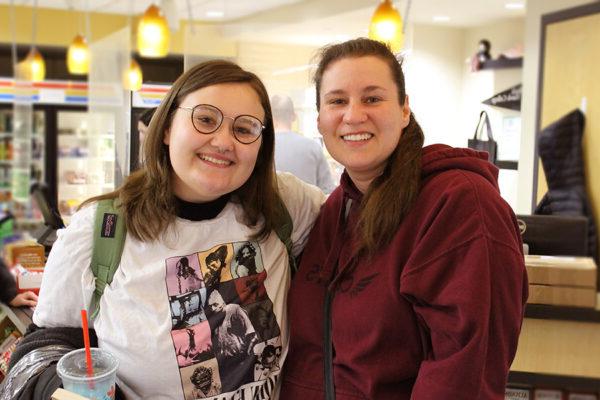 Mother and daughter pose for a photo in the black hawk bookstore.